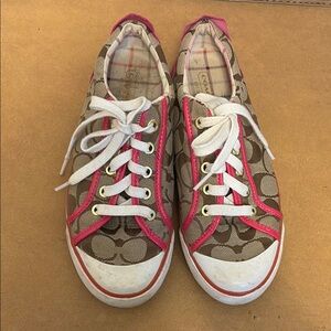 Coach lace up sneakers size 7.5
Monogram canvas Patent leather pink